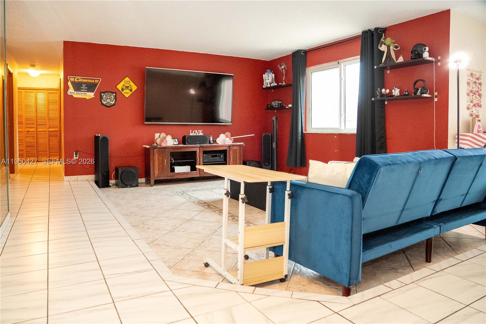 3700 Southwest 139th Avenue Miami, FL 33175 - Photo 7 of 40 a living room with furniture and a flat screen tv