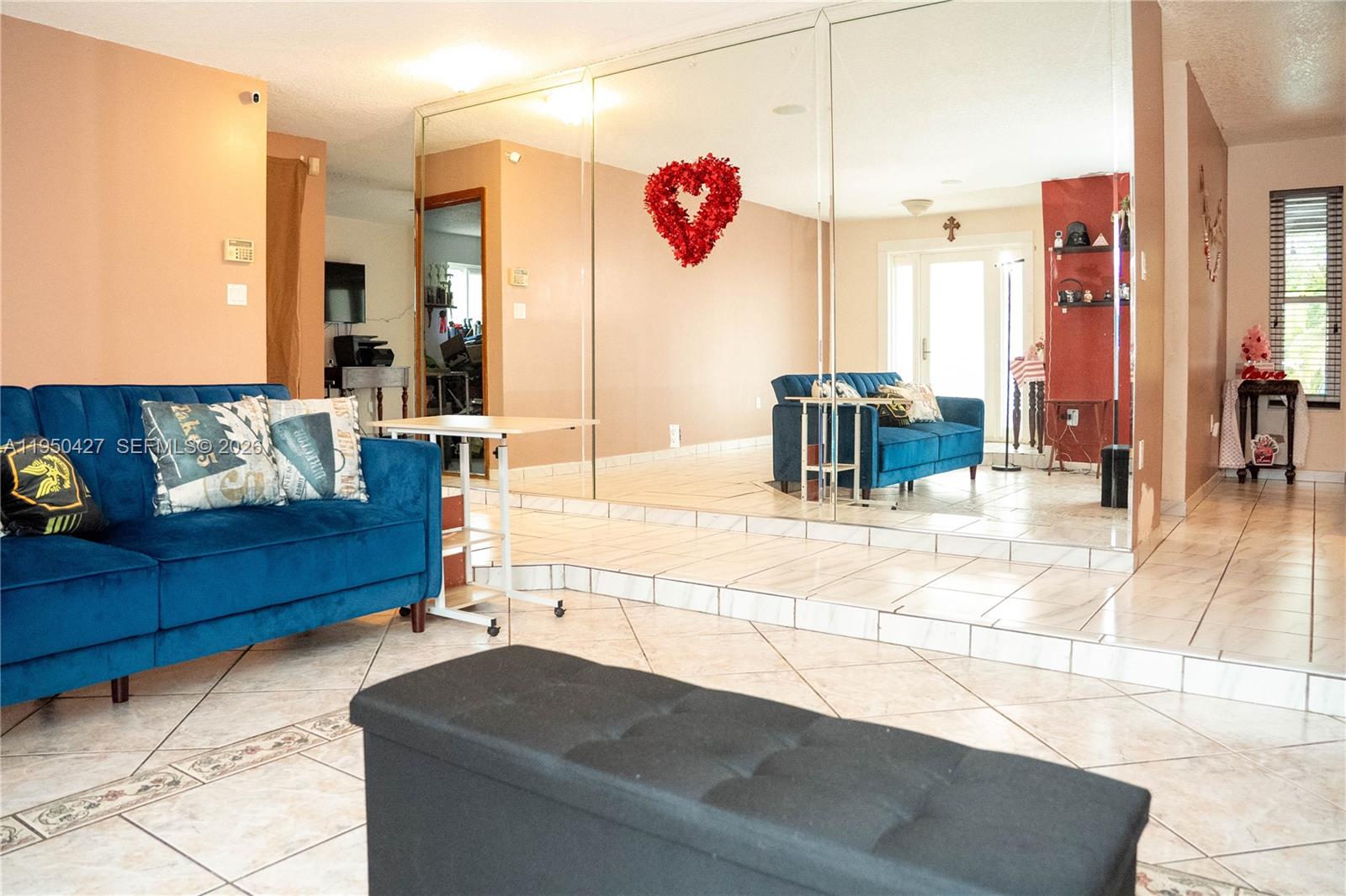 3700 Southwest 139th Avenue Miami, FL 33175 - Photo 10 of 40 a living room with furniture and a flat screen tv