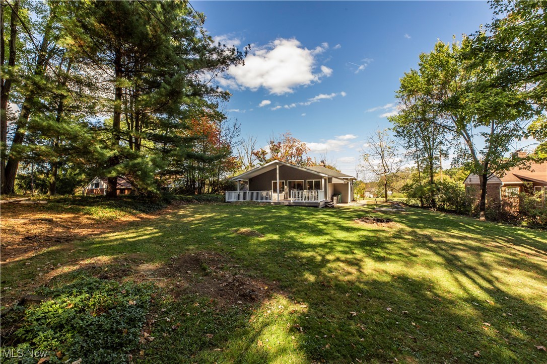 2430 Rockside Road Independence, OH 44131 - Photo 28 of 46 View of green lawn featuring a wooden deck