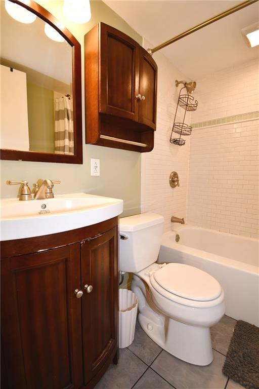 5 Bayard Road, Unit 100 Pittsburgh, PA 15213 - Photo 14 of 30 a bathroom with a sink a toilet and shower