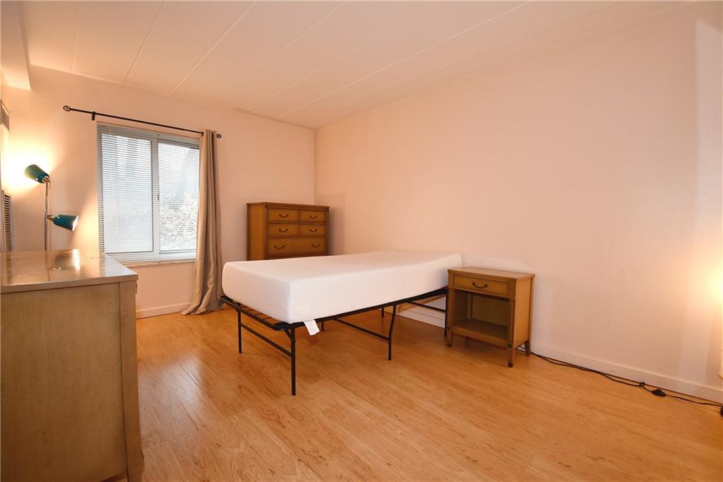 5 Bayard Road, Unit 100 Pittsburgh, PA 15213 - Photo 15 of 30 a living room with furniture a window and wooden floor