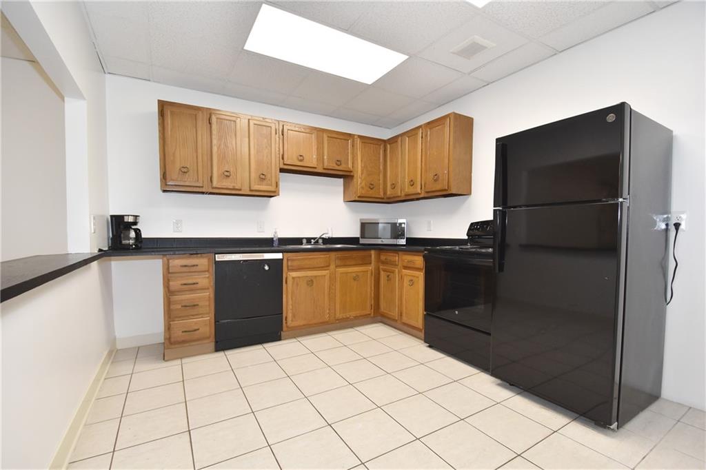 5 Bayard Road, Unit 100 Pittsburgh, PA 15213 - Photo 23 of 30 a kitchen with a sink a counter top space and stainless steel appliances