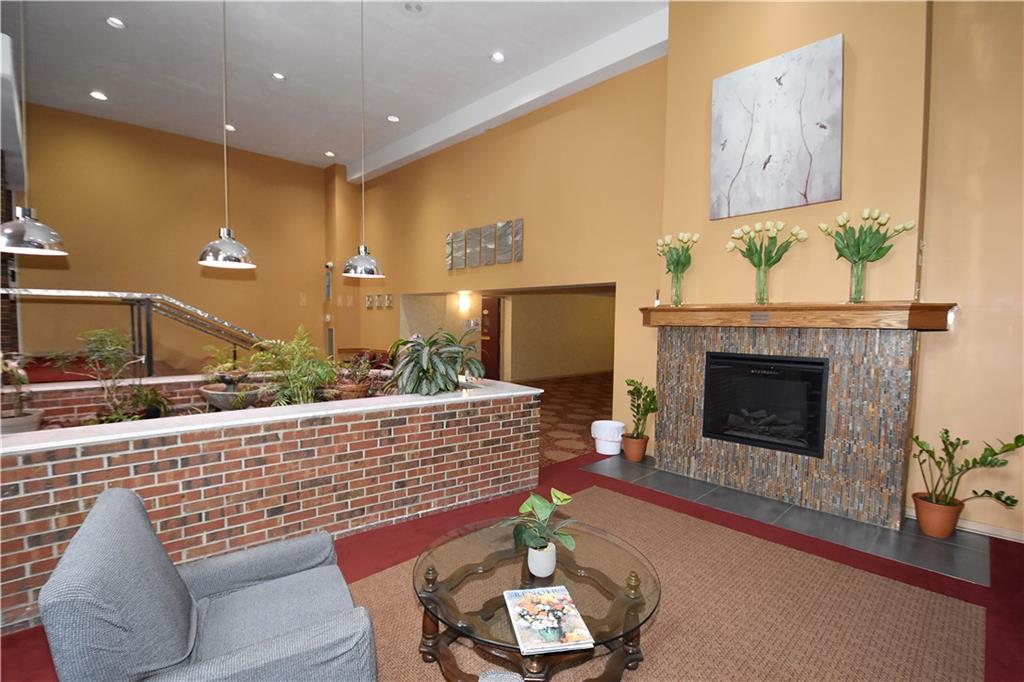 5 Bayard Road, Unit 100 Pittsburgh, PA 15213 - Photo 4 of 30 a living room with furniture and a fireplace