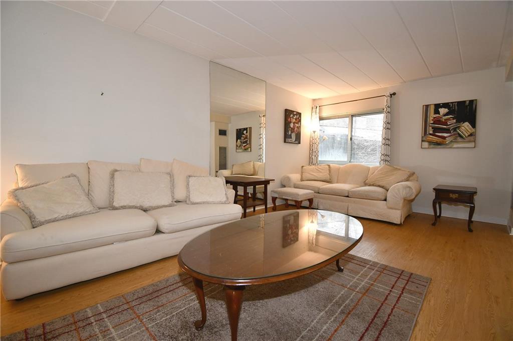 5 Bayard Road, Unit 100 Pittsburgh, PA 15213 - Photo 6 of 30 a living room with furniture and a table
