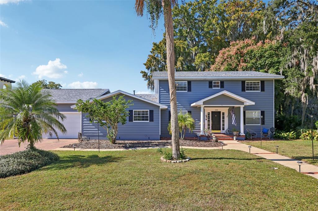 1105 South 9th Street Leesburg, FL 34748 - Photo 1 of 69 a front view of a house with a yard