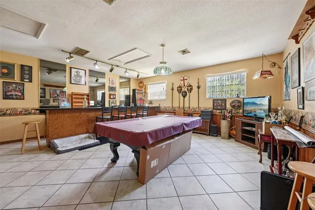 a bedroom with furniture and wooden floor