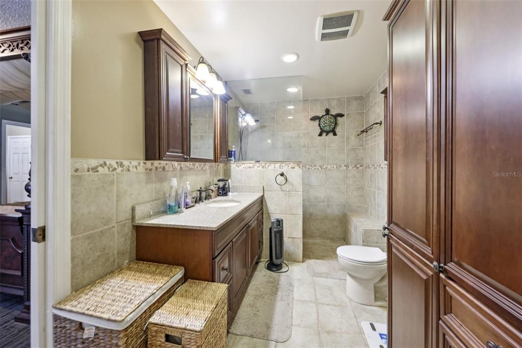 1105 South 9th Street Leesburg, FL 34748 - Photo 30 of 69 a bathroom with a sink toilet and shower