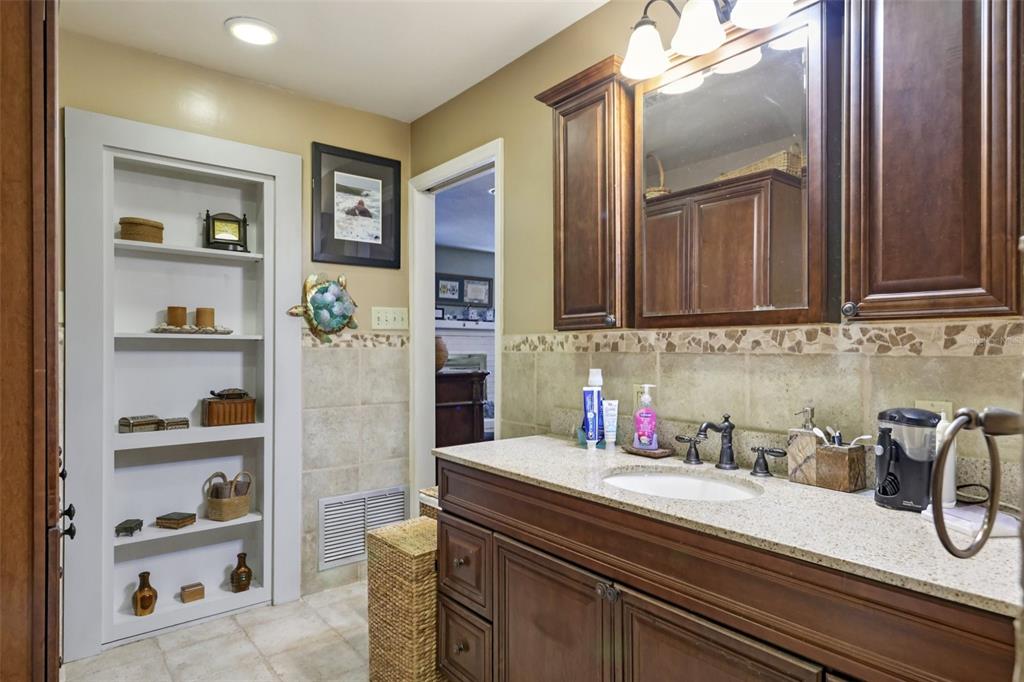 1105 South 9th Street Leesburg, FL 34748 - Photo 31 of 69 a kitchen with a sink and cabinets