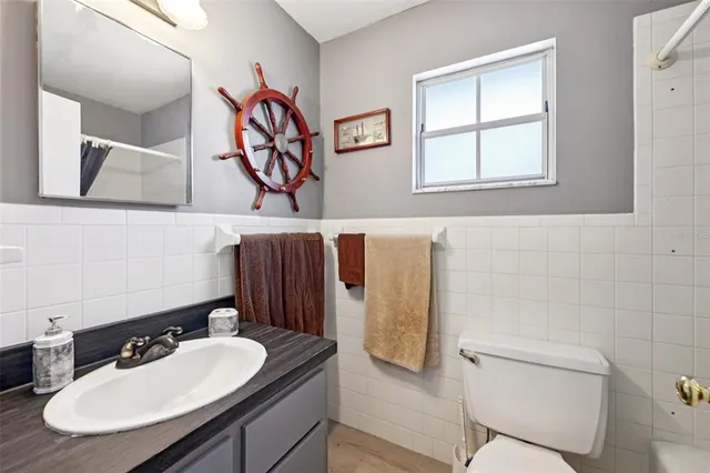 a view of a house that has a table and chairs in it