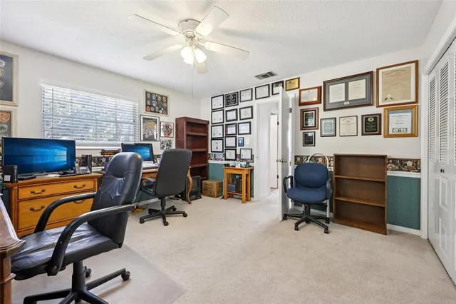 a view of a lake with a house in the background
