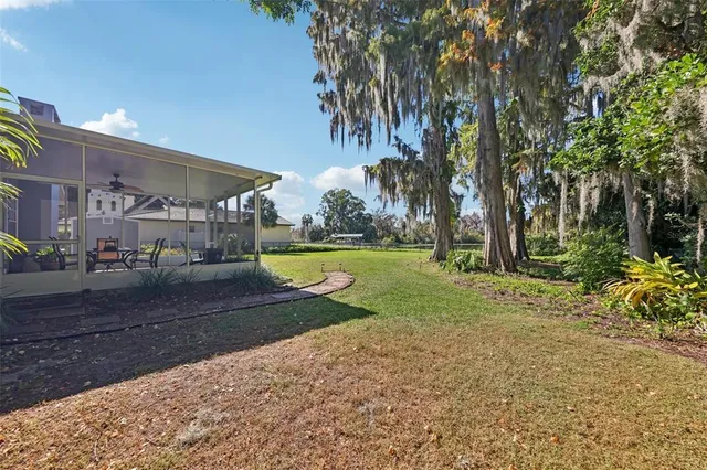 an aerial view of multiple houses with yard