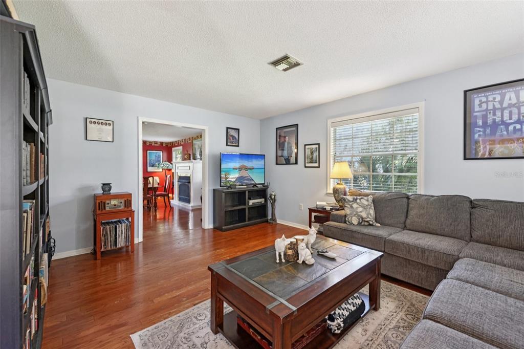 1105 South 9th Street Leesburg, FL 34748 - Photo 7 of 69 a living room with furniture and a window