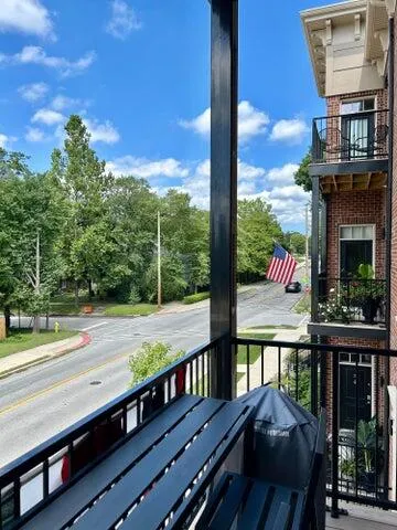 a view of a two chairs and table in the balcony