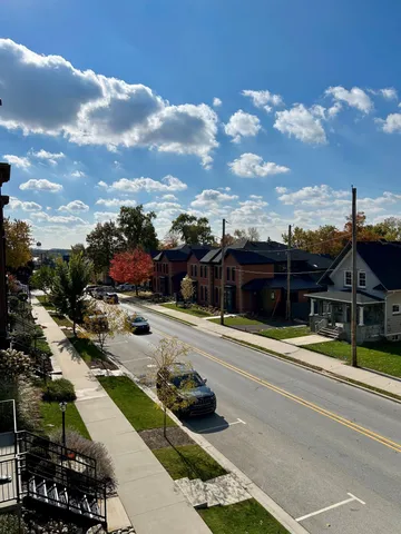 a living room with furniture fireplace and flat screen tv