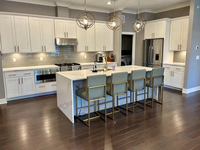 a bedroom with bed and a large window