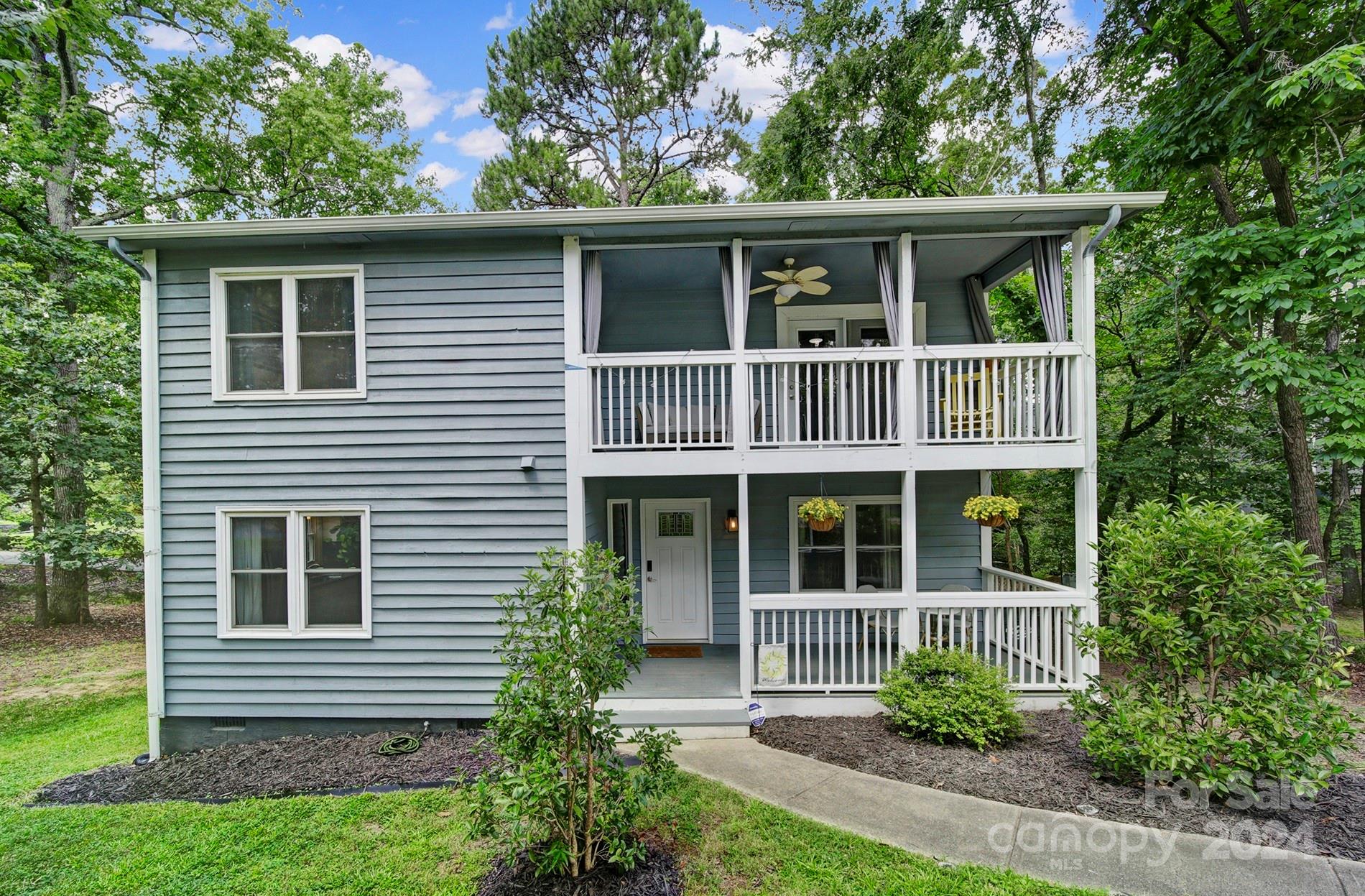 6027 Windjammer Drive Tega Cay, SC 29708 - Photo 1 of 27 a house view with a garden space