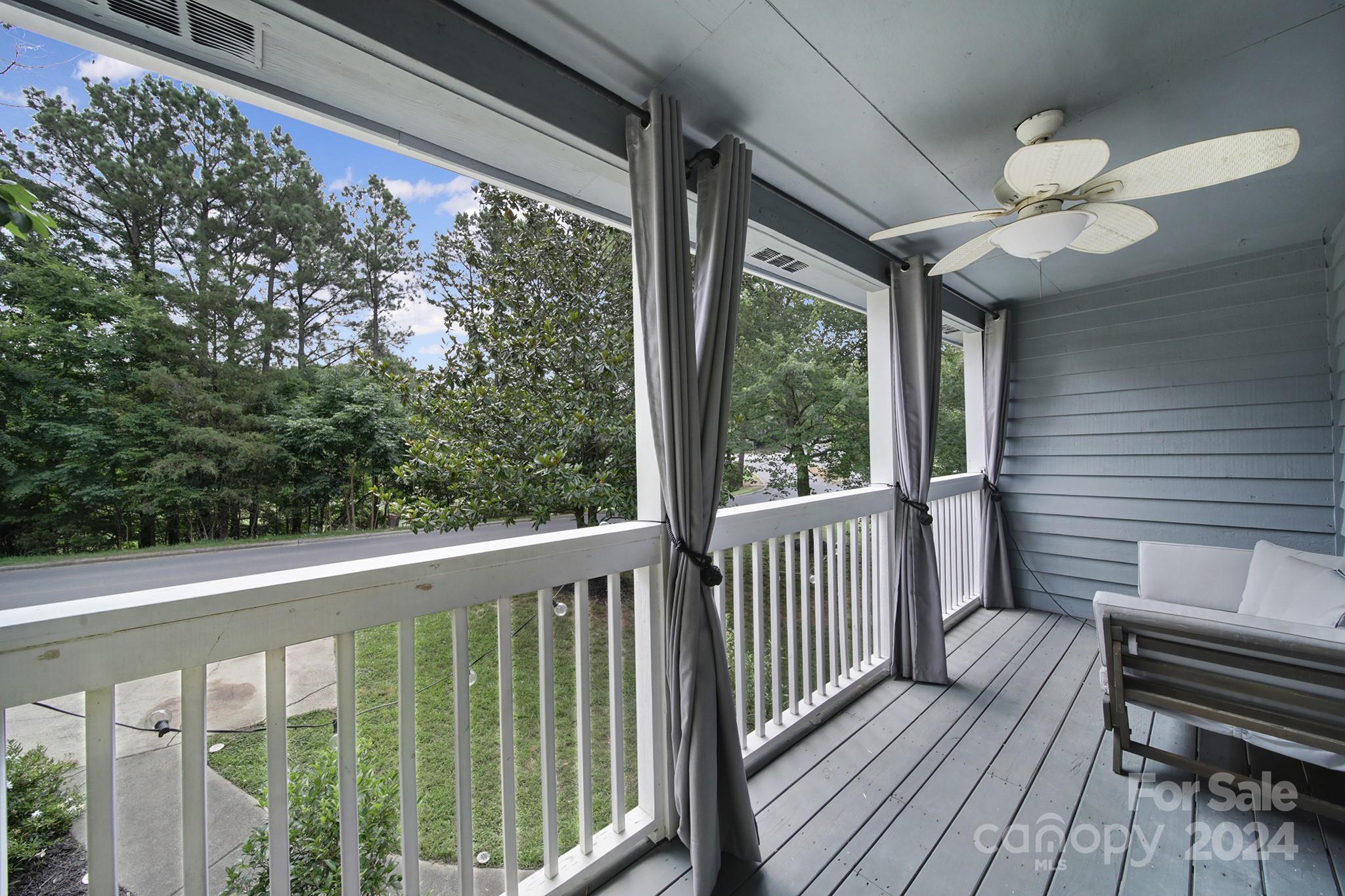 6027 Windjammer Drive Tega Cay, SC 29708 - Photo 21 of 27 a view of a balcony with wooden floor