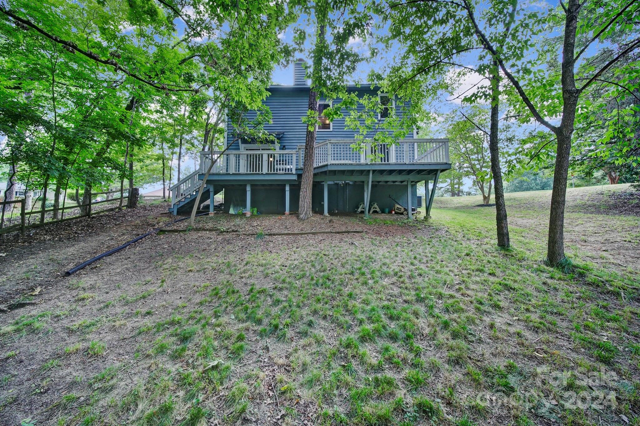 6027 Windjammer Drive Tega Cay, SC 29708 - Photo 22 of 27 a view of a house with a yard