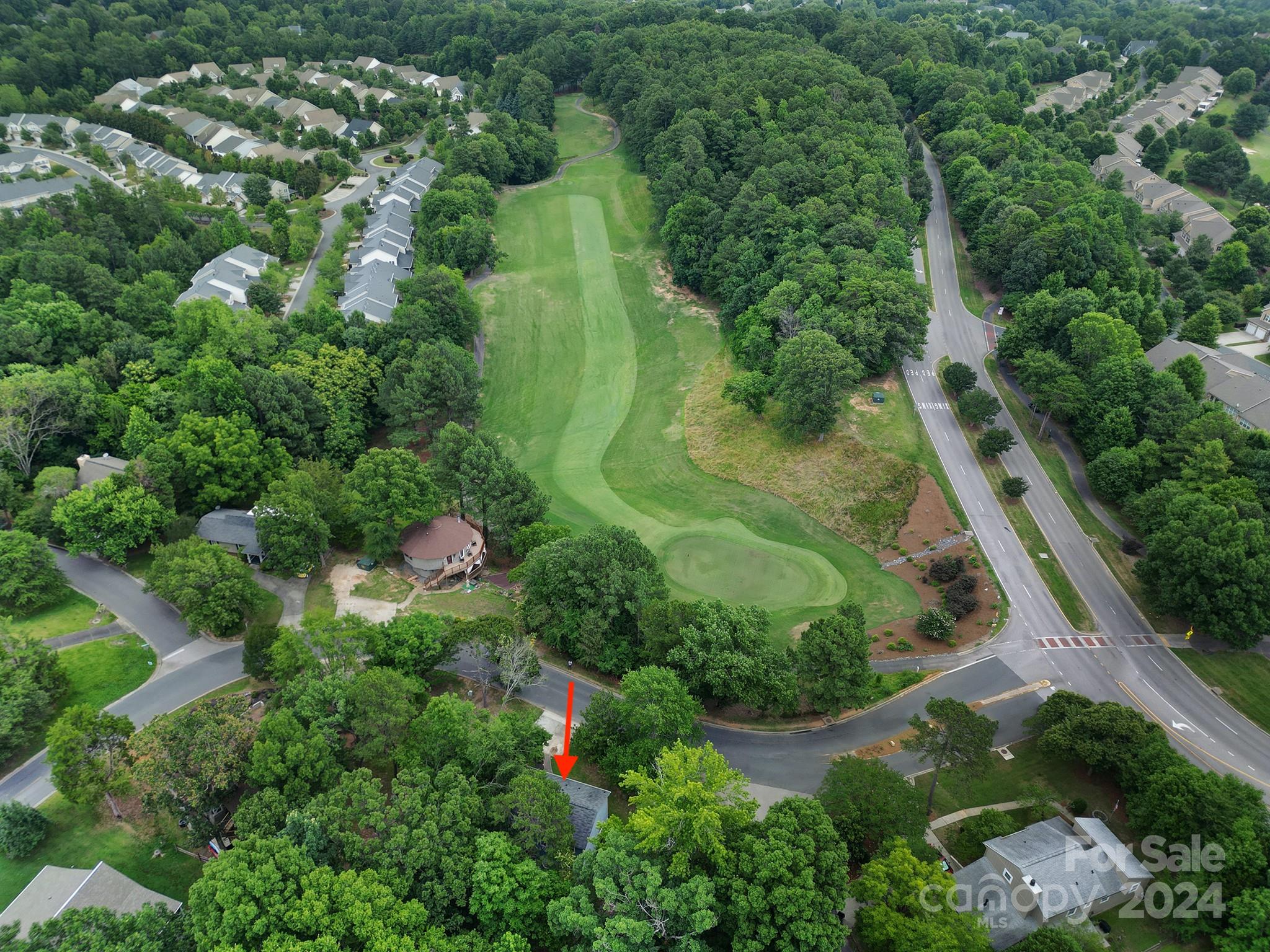 6027 Windjammer Drive Tega Cay, SC 29708 - Photo 4 of 27 an aerial view of residential house with outdoor space and trees all around