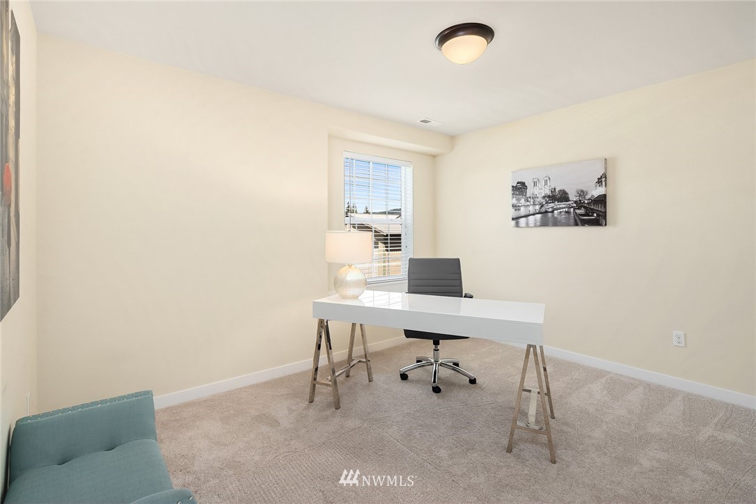 5115 Northeast 6th Place Renton, WA 98059 - Photo 16 of 26 a view of a workspace with furniture and a window