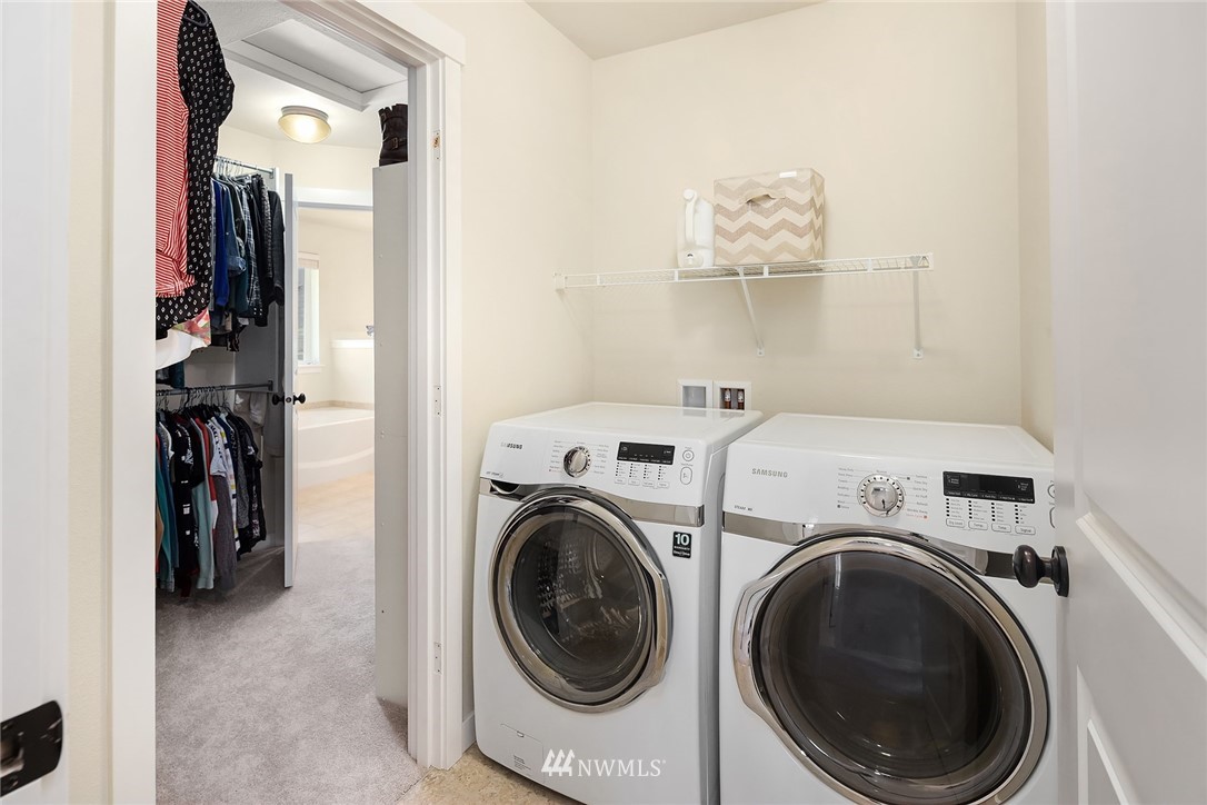 5115 Northeast 6th Place Renton, WA 98059 - Photo 22 of 26 a view of a storage & utility room with dryer and washer