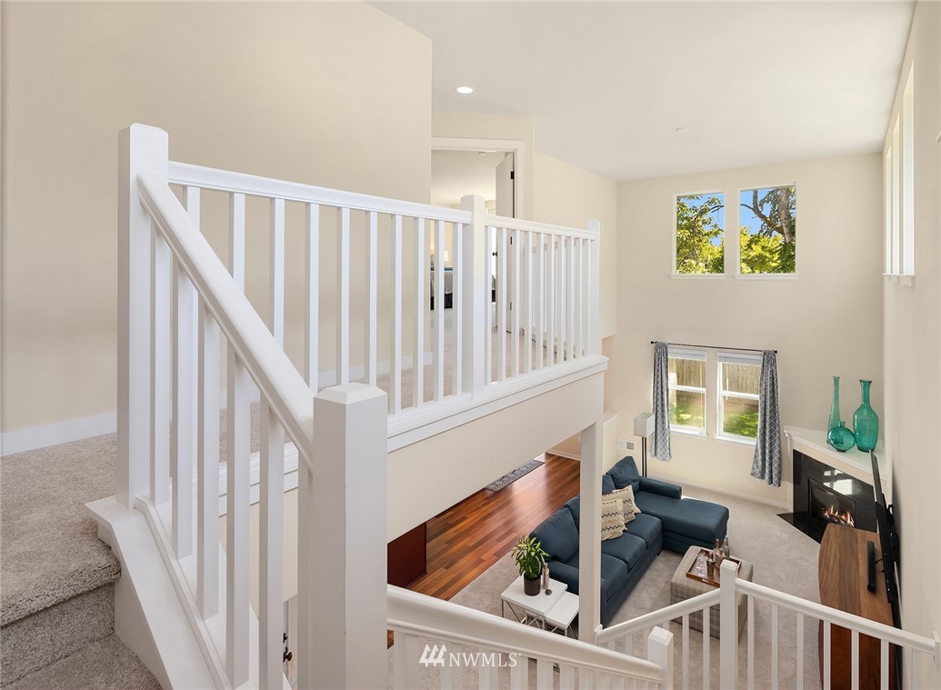 5115 Northeast 6th Place Renton, WA 98059 - Photo 23 of 26 a view of staircase with furniture and a front door