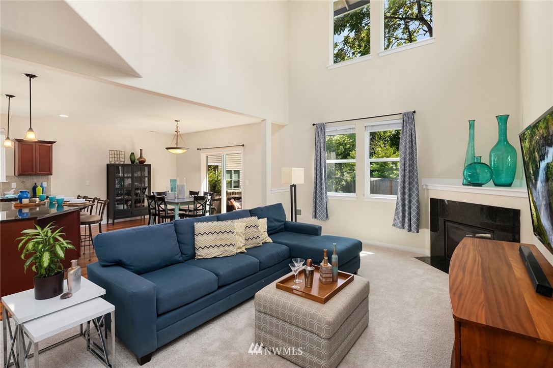 5115 Northeast 6th Place Renton, WA 98059 - Photo 7 of 26 a living room with fireplace furniture and a wooden floor