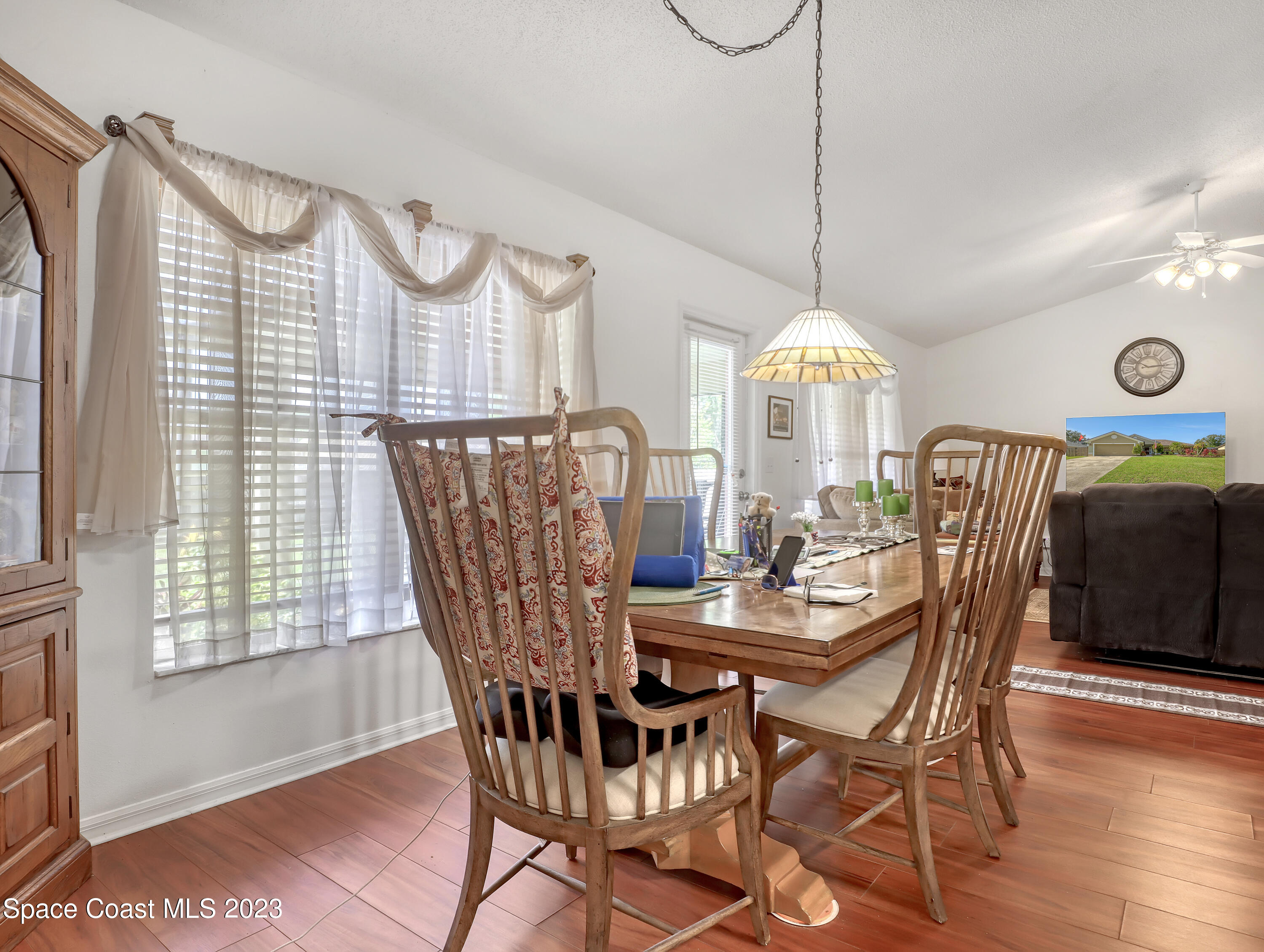 1550 Reed Street Northwest Palm Bay, FL 32907 - Photo 15 of 33 a view of a dining room with furniture window and wooden floor
