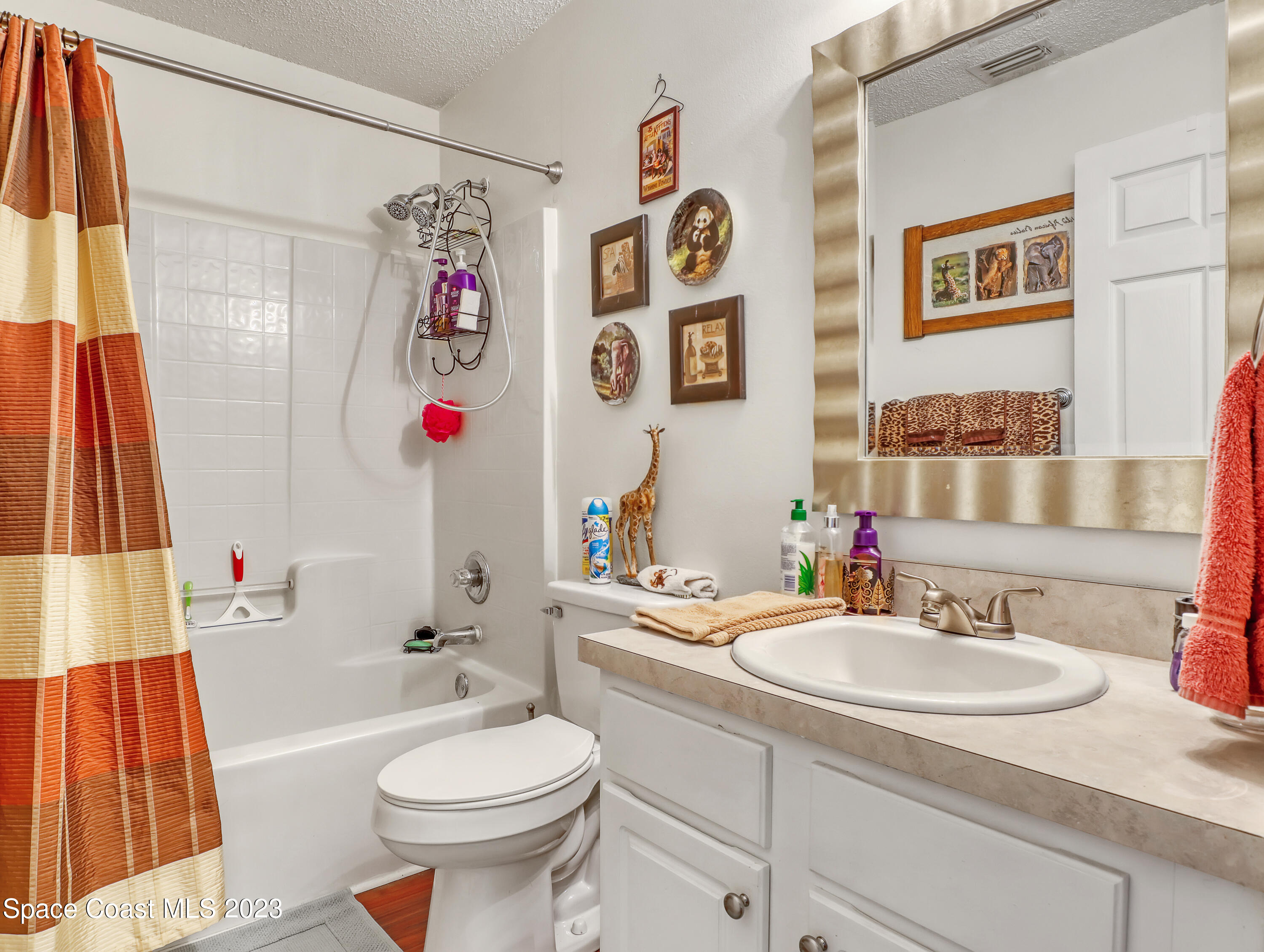 1550 Reed Street Northwest Palm Bay, FL 32907 - Photo 23 of 33 a bathroom with a sink toilet and a bathtub