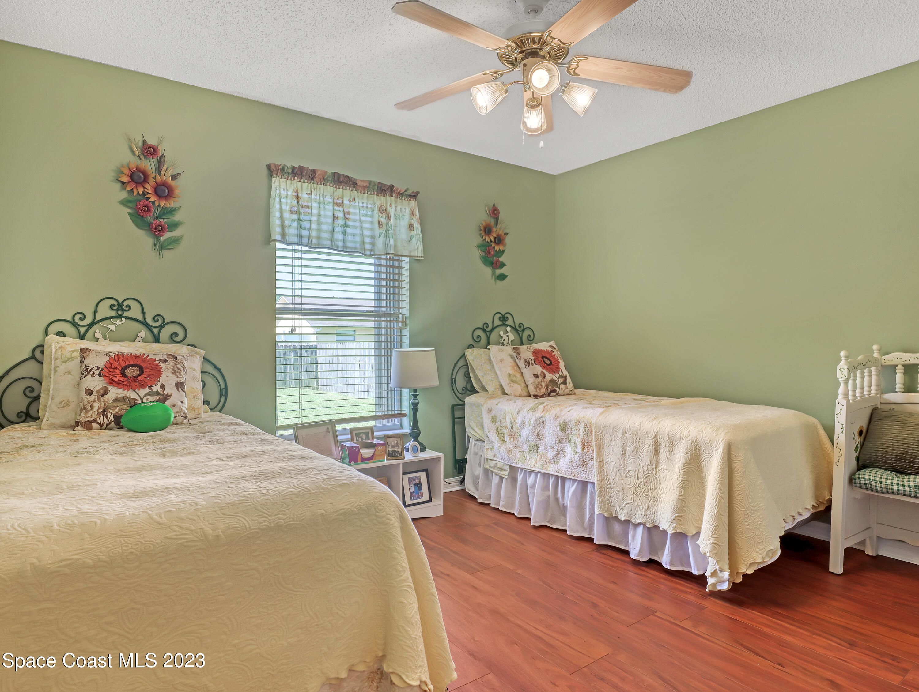 1550 Reed Street Northwest Palm Bay, FL 32907 - Photo 24 of 33 a bedroom with a bed and a window
