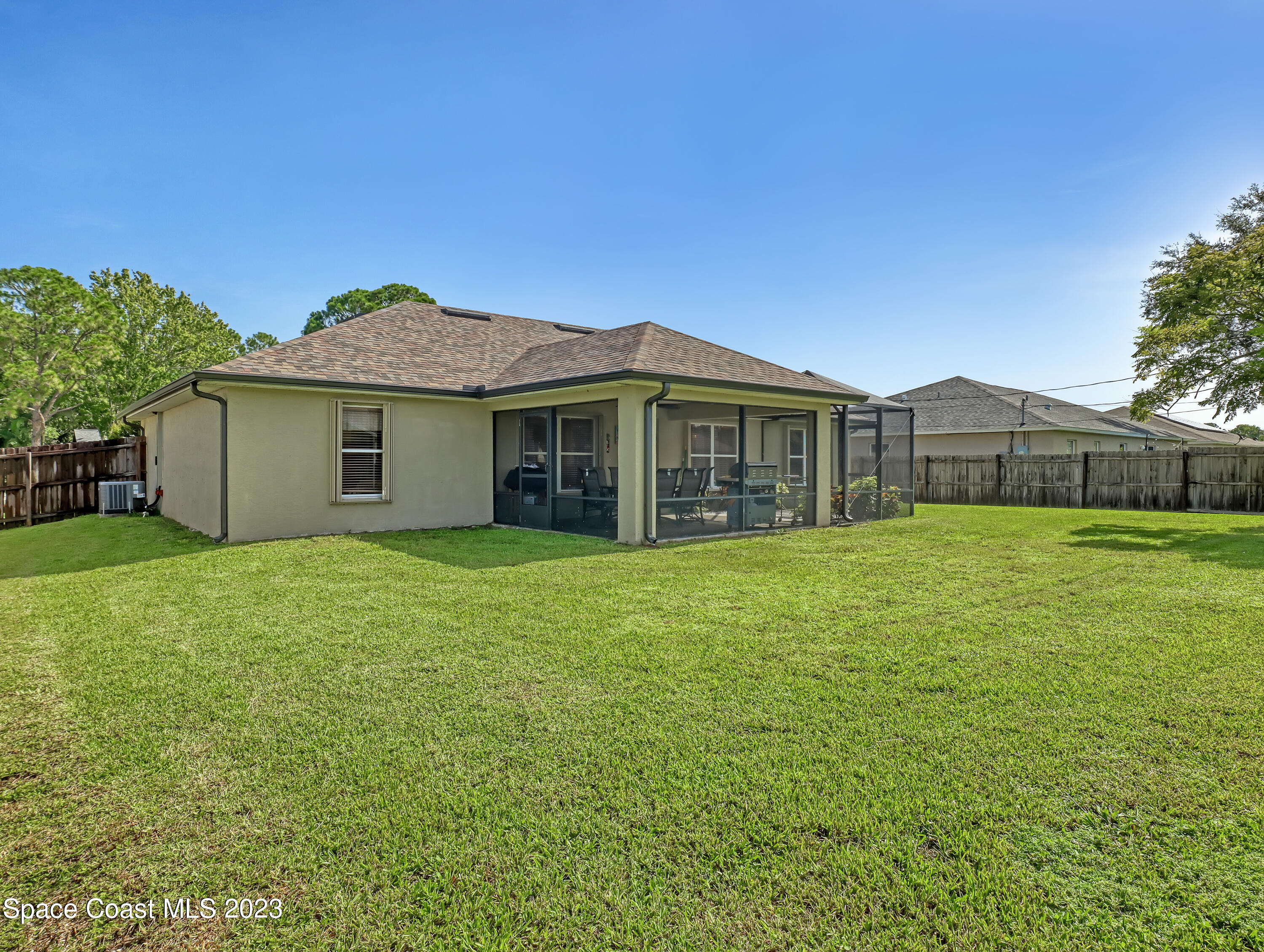 1550 Reed Street Northwest Palm Bay, FL 32907 - Photo 30 of 33 a front view of a house with a garden