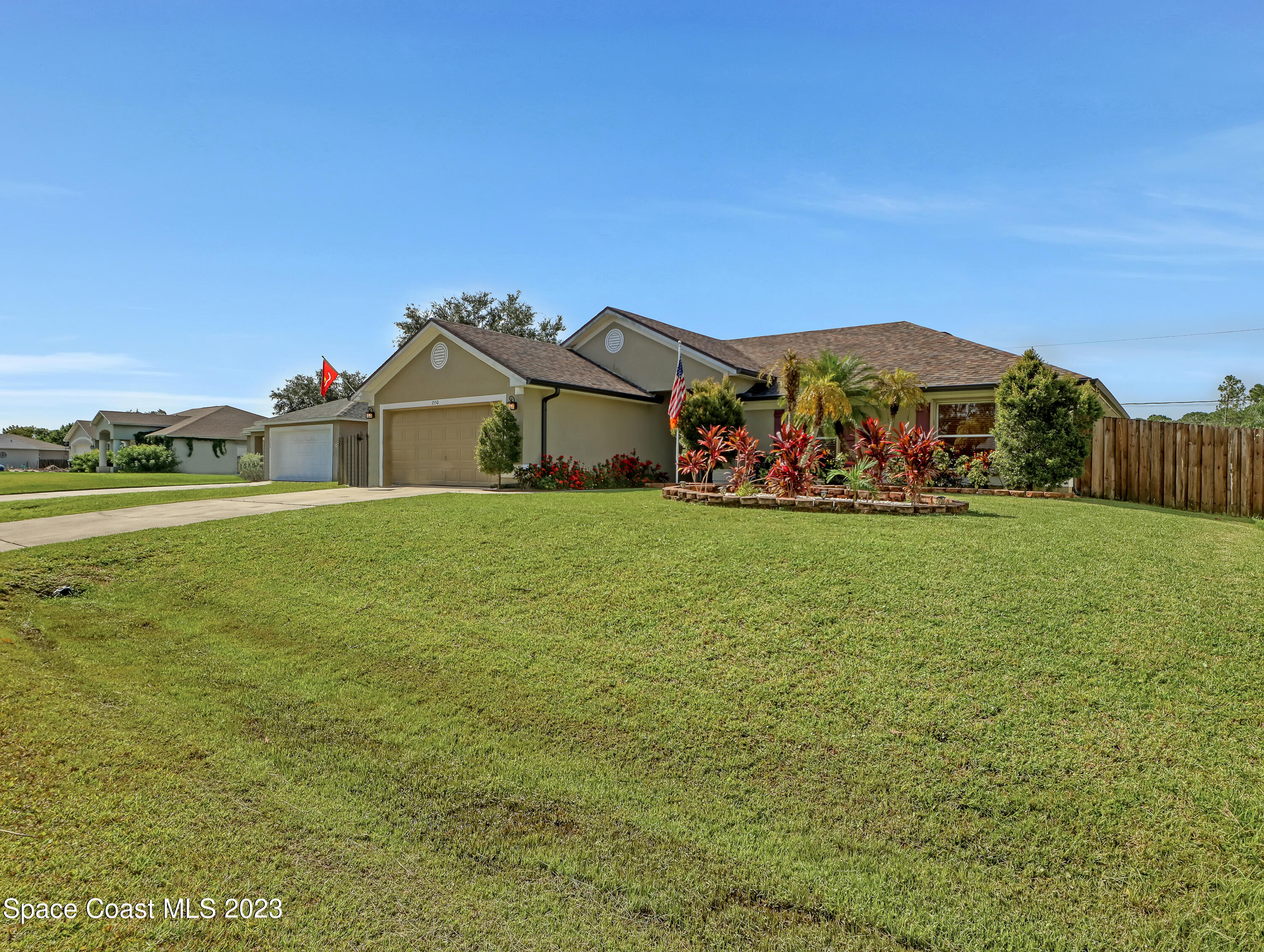 1550 Reed Street Northwest Palm Bay, FL 32907 - Photo 3 of 33 a view of a house with a big yard