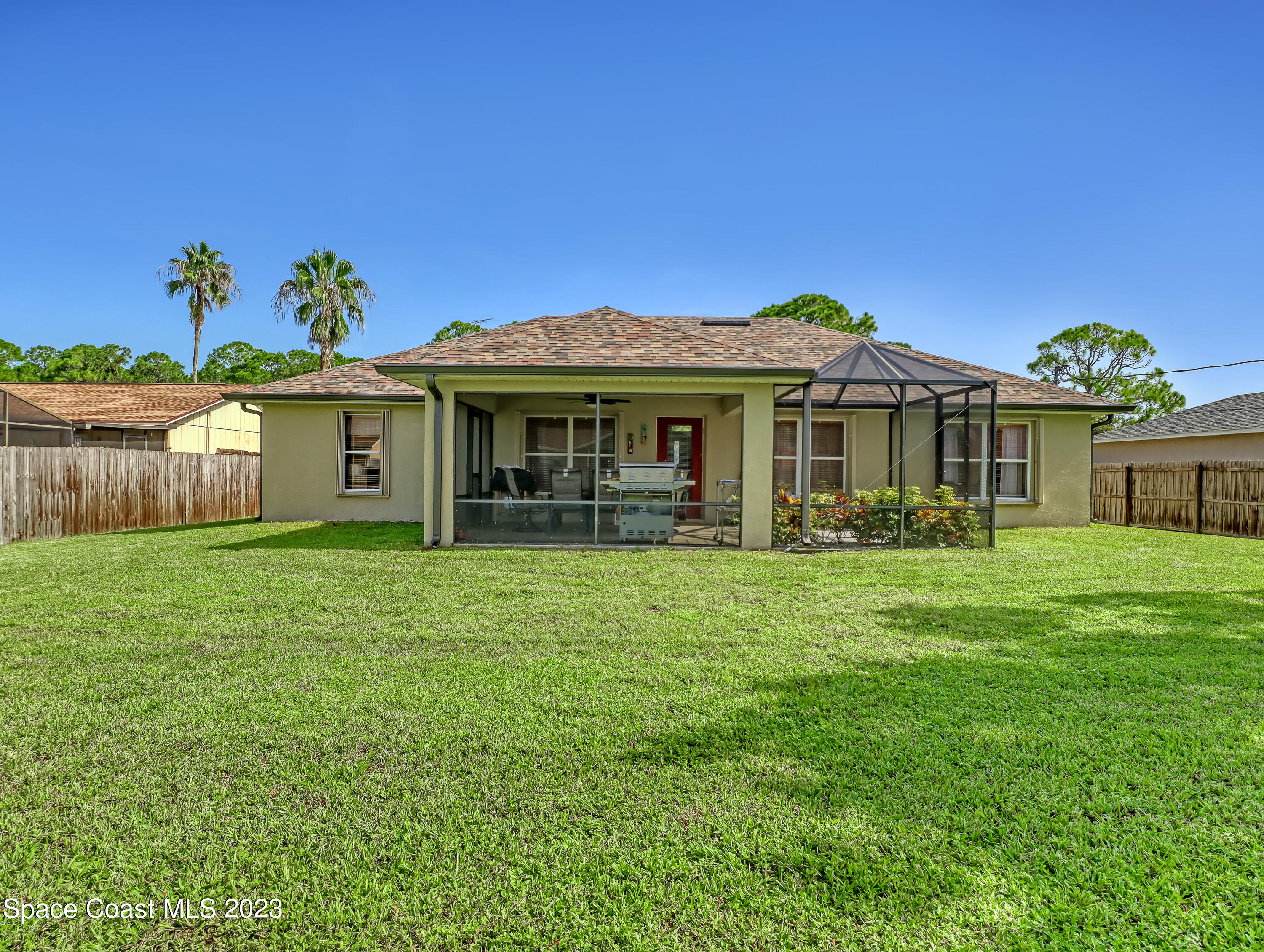 1550 Reed Street Northwest Palm Bay, FL 32907 - Photo 31 of 33 a front view of a house with a garden