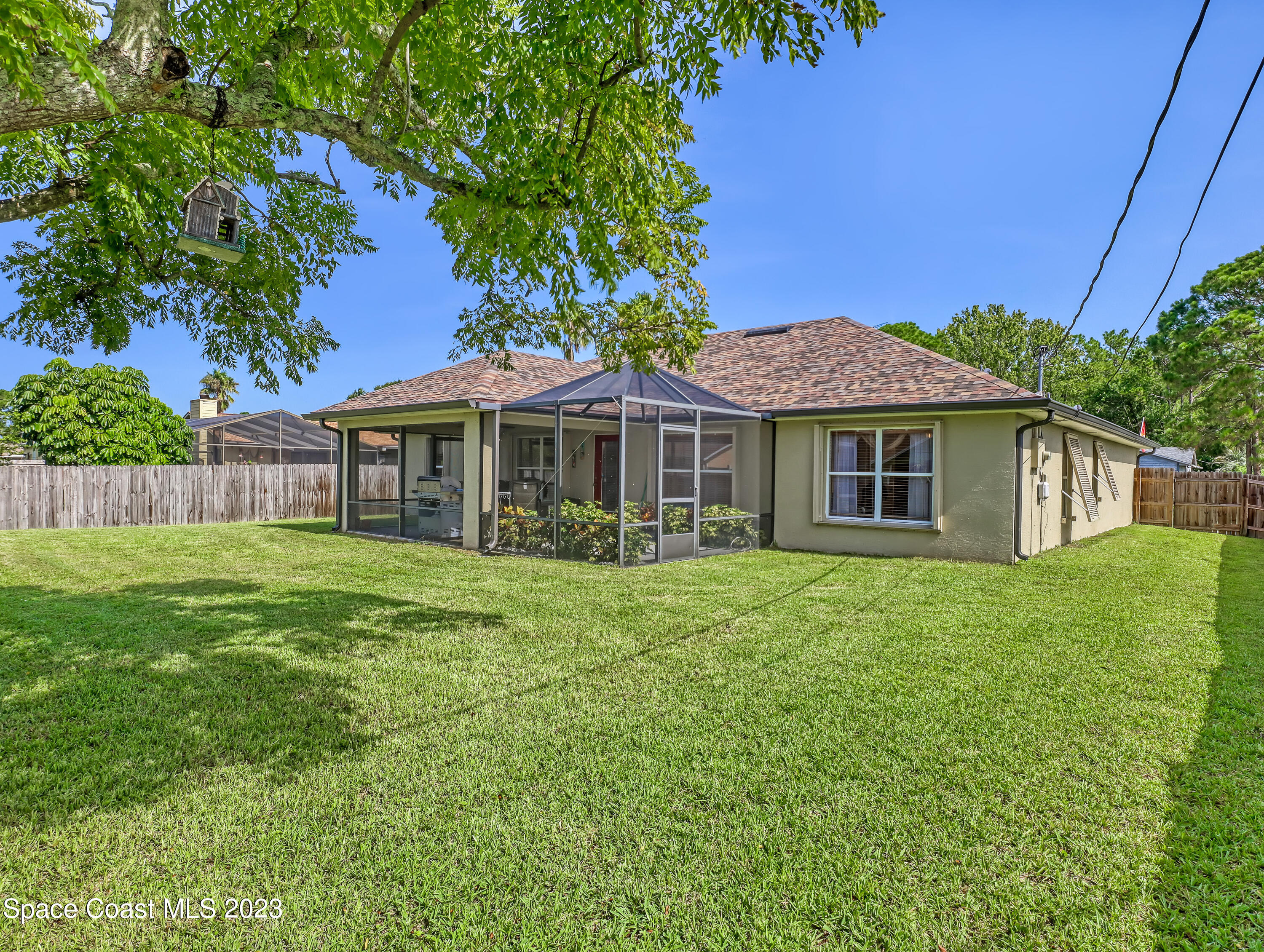 1550 Reed Street Northwest Palm Bay, FL 32907 - Photo 32 of 33 a front view of a house with a garden