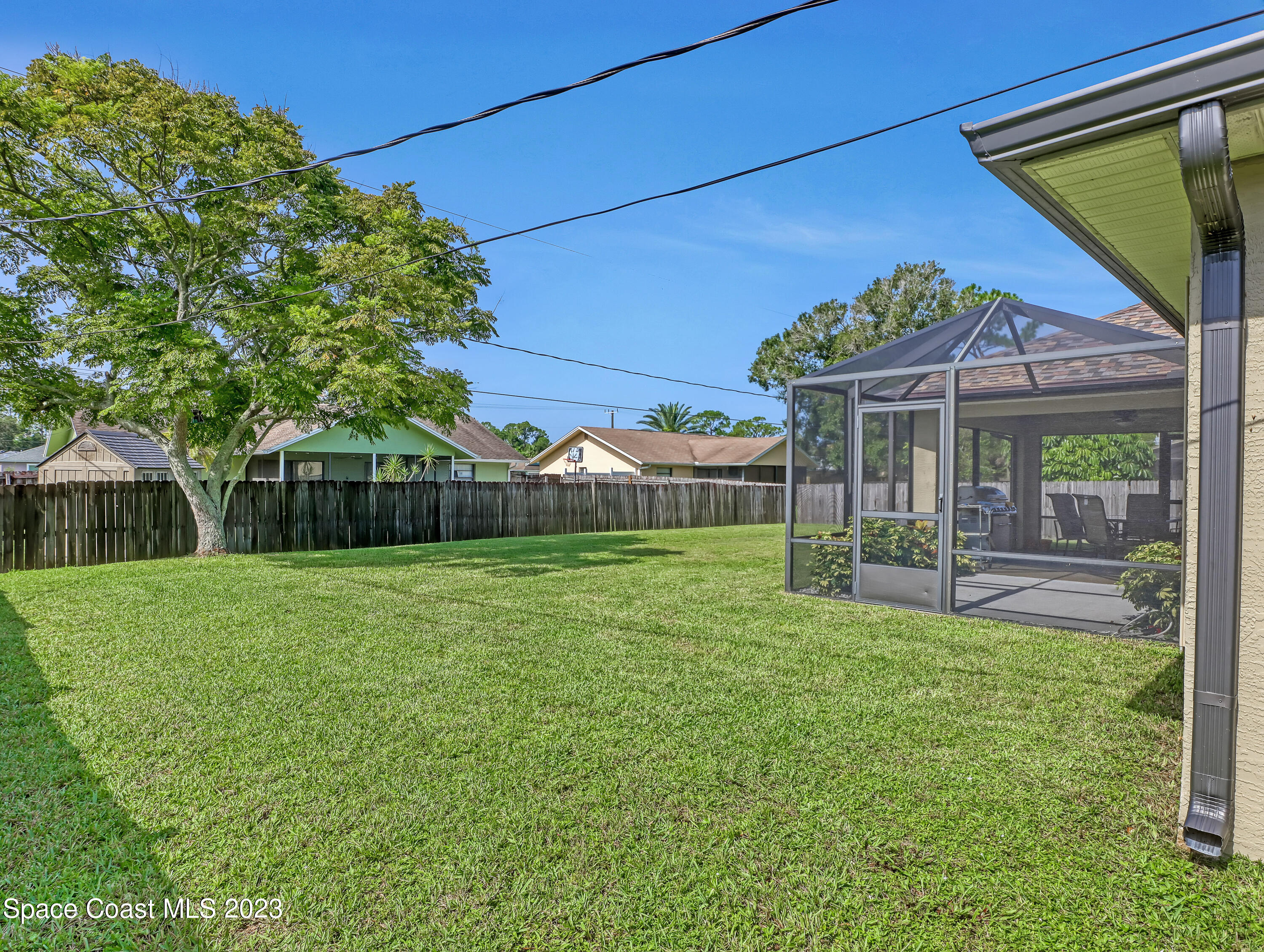 1550 Reed Street Northwest Palm Bay, FL 32907 - Photo 33 of 33 a view of a house with a yard porch and sitting area