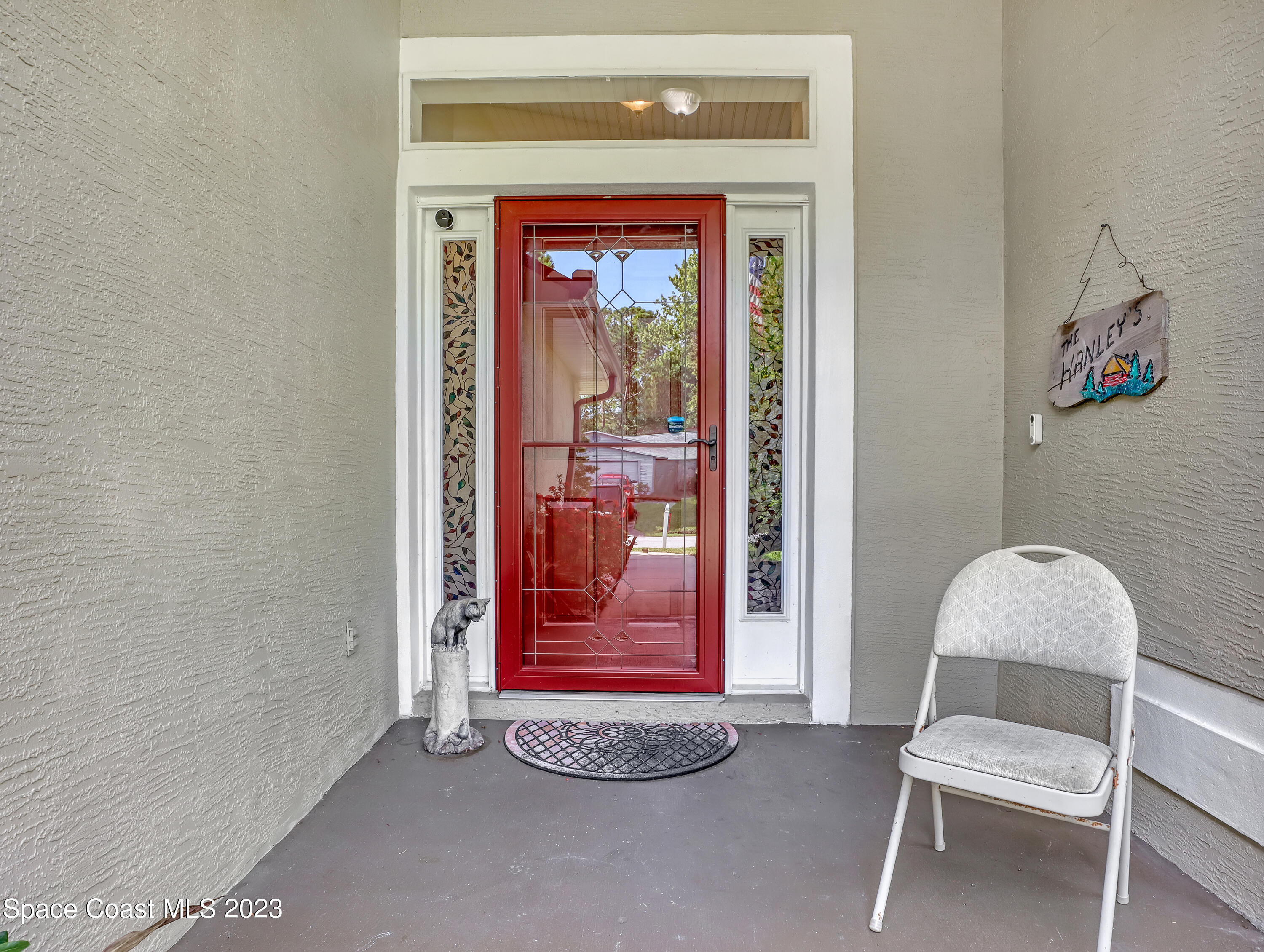 1550 Reed Street Northwest Palm Bay, FL 32907 - Photo 4 of 33 a view of a hallway with front door