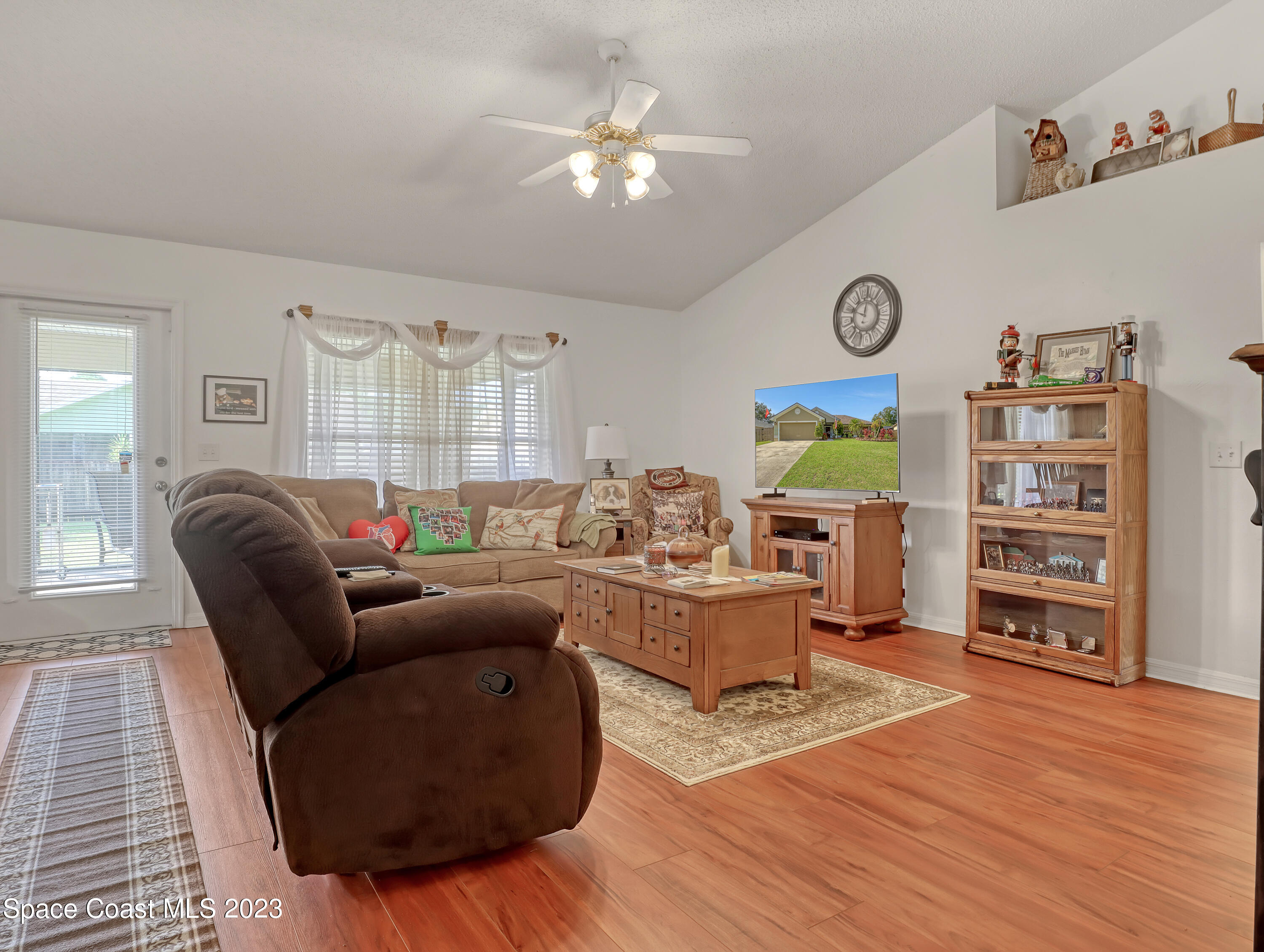 1550 Reed Street Northwest Palm Bay, FL 32907 - Photo 6 of 33 a living room with furniture and a wooden floor