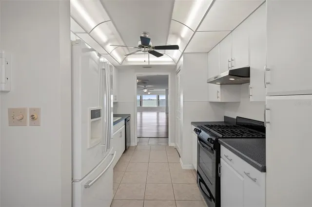 a kitchen with stainless steel appliances a stove and a refrigerator