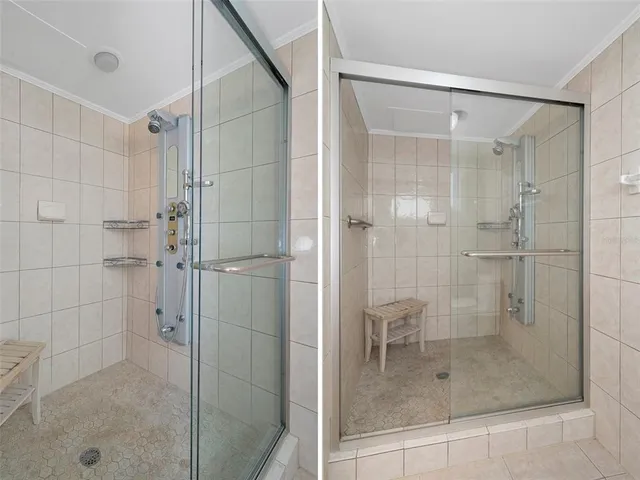 a bathroom with a glass door shower
