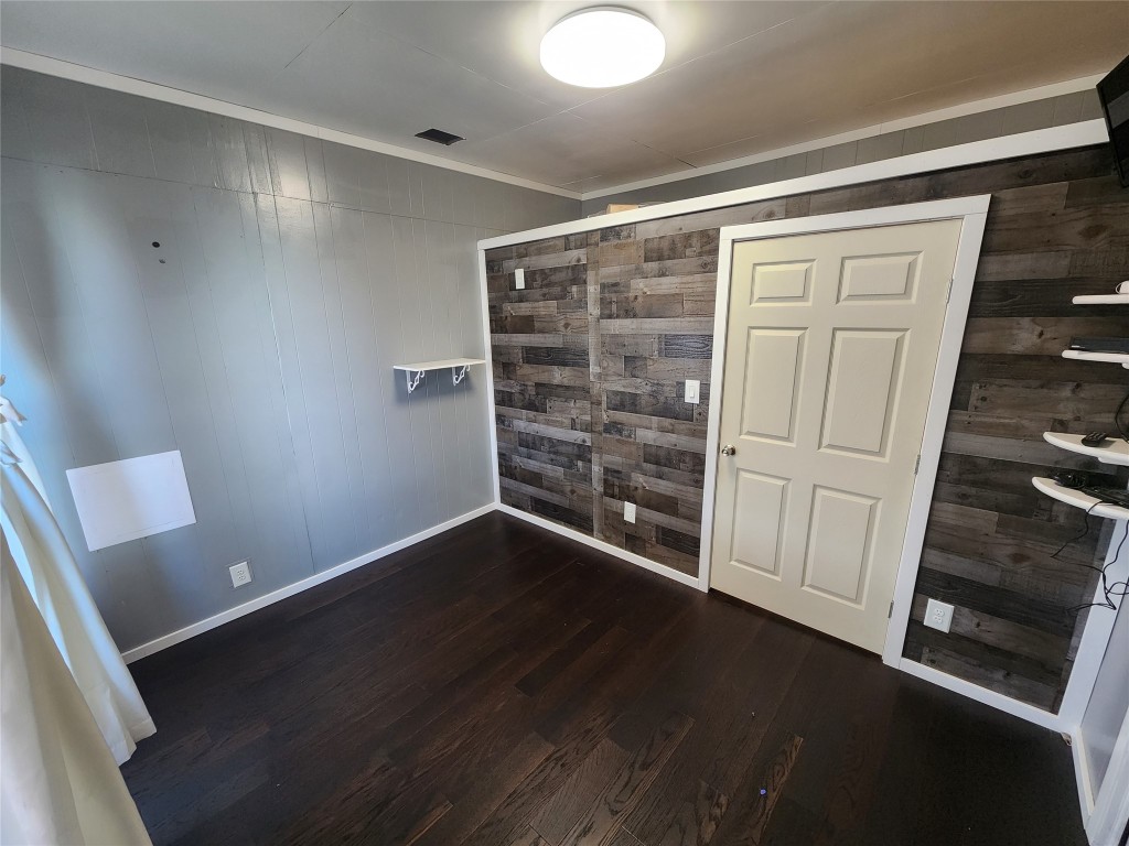 10001 Farm To Market Road 1331 Taylor, TX 76574 - Photo 5 of 10 a view of an empty room with wooden floor and closet