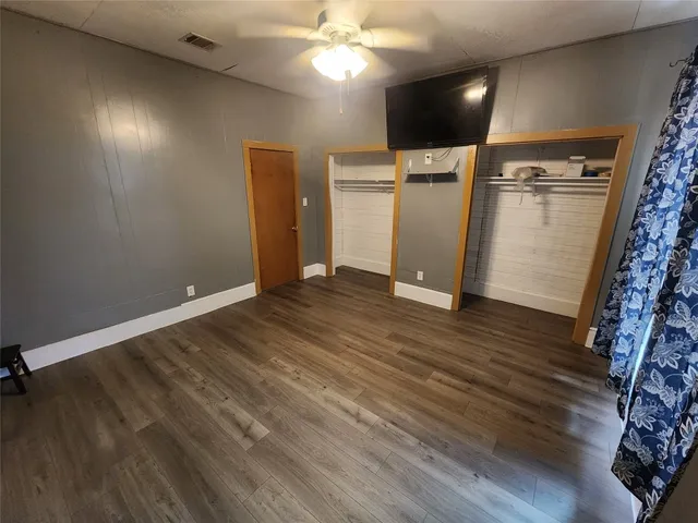a view of a livingroom with wooden floor