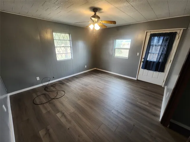 a view of entryway with window and wooden floor