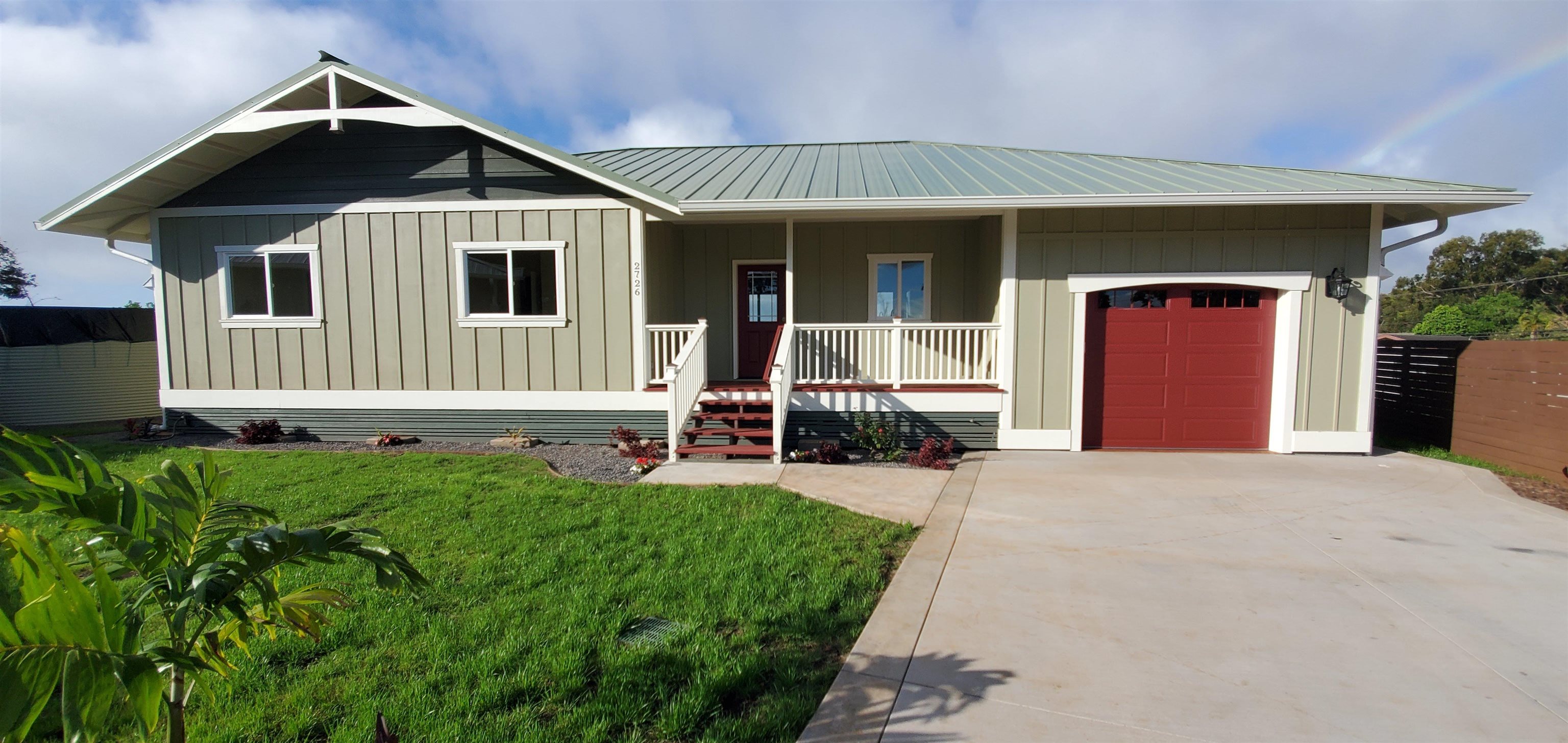 a front view of a house with yard