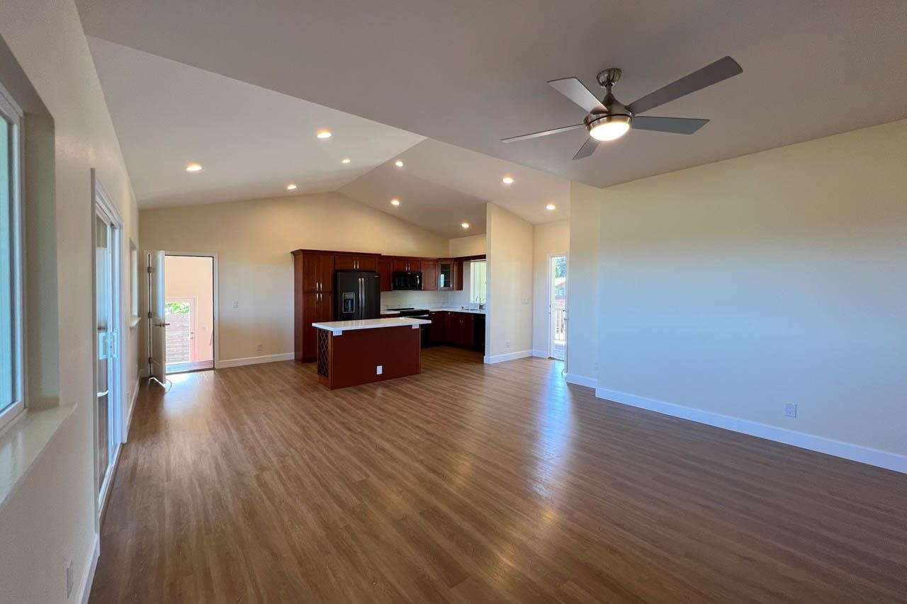 2728 Kaupakalua Road, Unit B Haiku, HI 96708 - Photo 11 of 29 a room with furniture and wooden floor