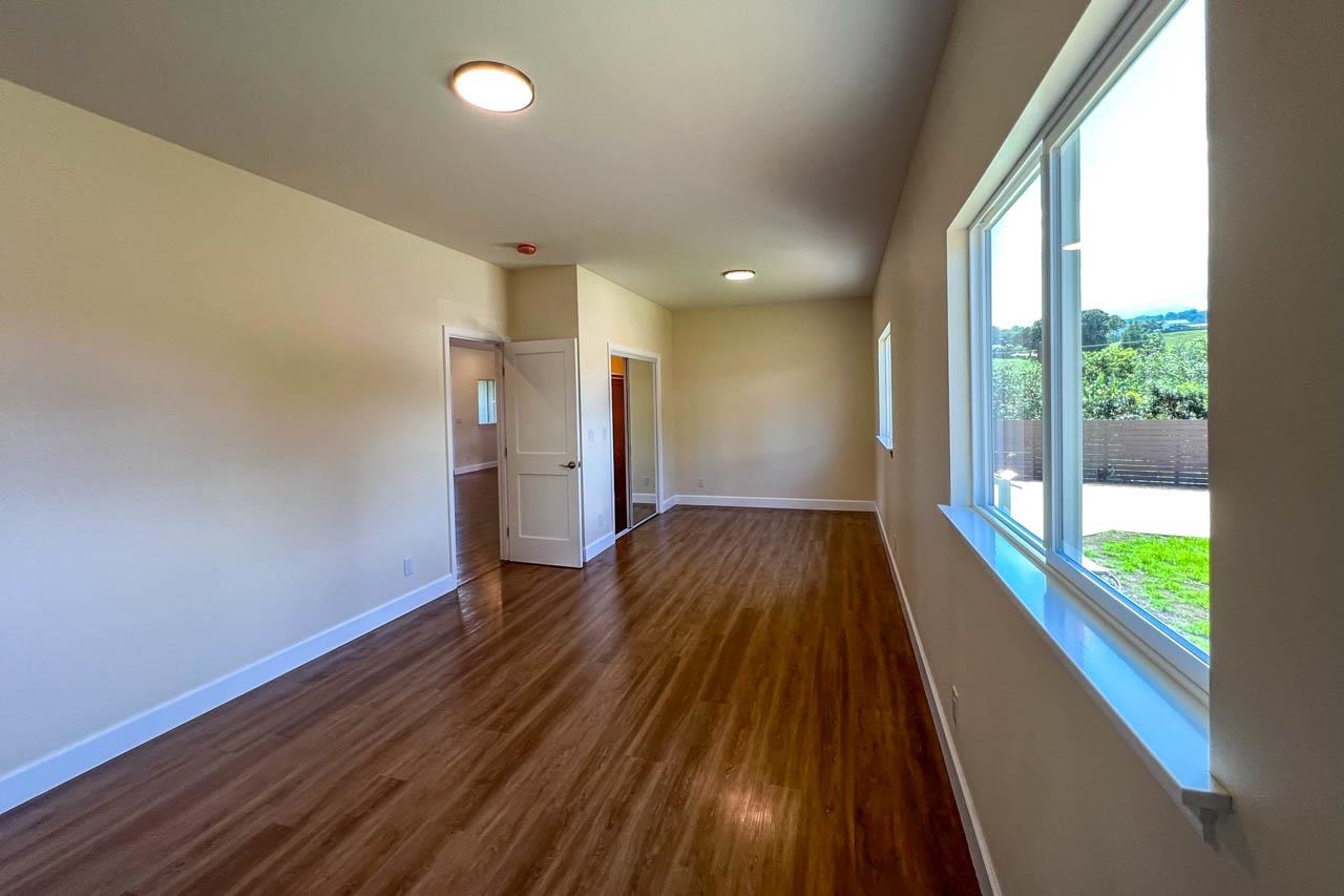 2728 Kaupakalua Road, Unit B Haiku, HI 96708 - Photo 15 of 29 wooden floor in an empty room with a window
