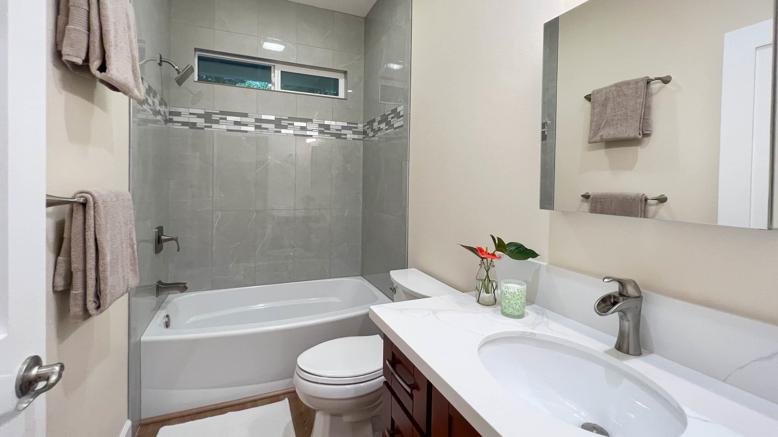 2728 Kaupakalua Road, Unit B Haiku, HI 96708 - Photo 17 of 29 a bathroom with a sink toilet and shower
