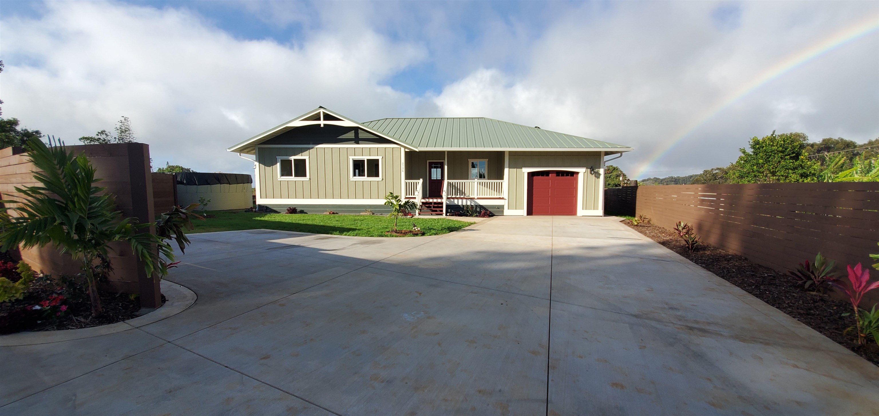 2728 Kaupakalua Road, Unit B Haiku, HI 96708 - Photo 4 of 29 a front view of a house with a yard and garage