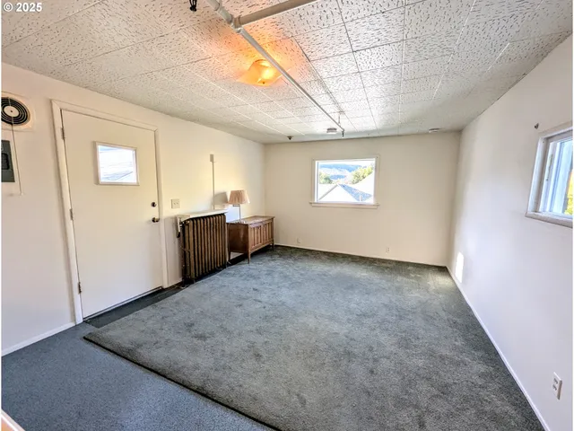 a view of a room with large window