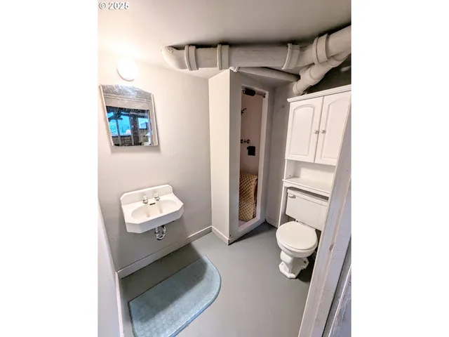 a view of a kitchen with furniture and a window