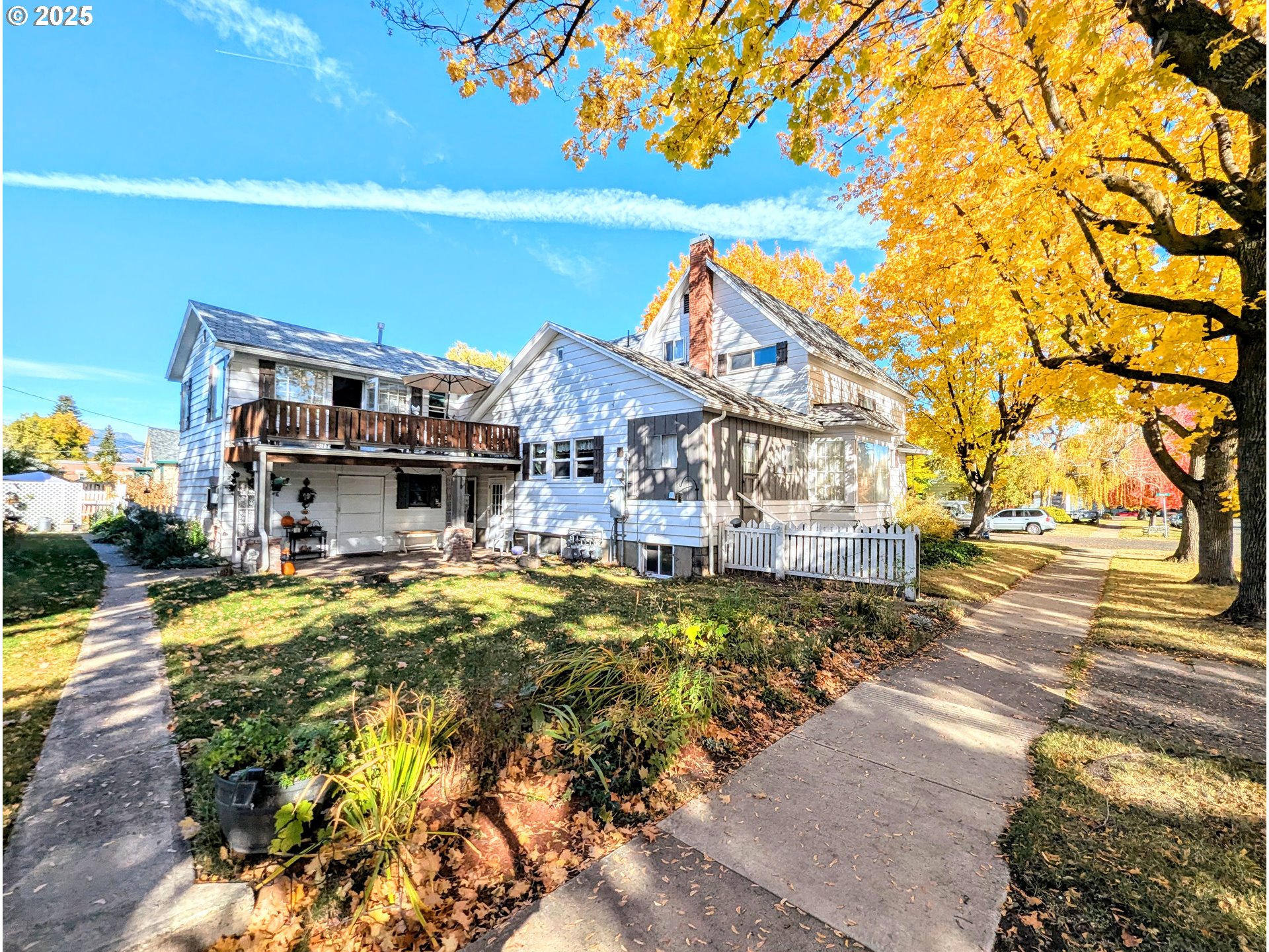 1802 3rd Street La Grande, OR 97850 - Photo 3 of 21 a view of a house with a yard patio and swimming pool